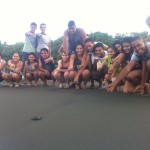 Costa Rican students and baby turtle